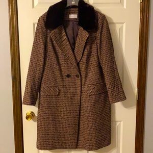 Lined Dressy mid length lined jacket with faux fur collar. New without tags.
